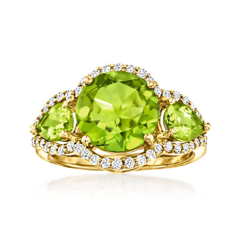 14k yellow gold ring with large green peridot and diamond halo with side stones