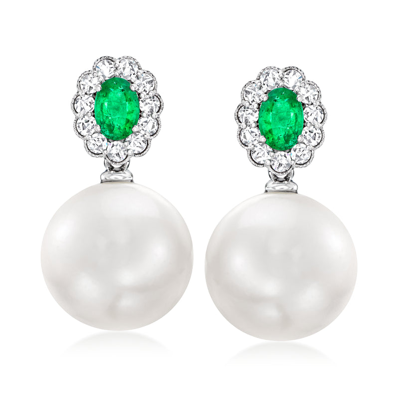 White pearl drop earrings with green emerald center and diamond halo on white gold