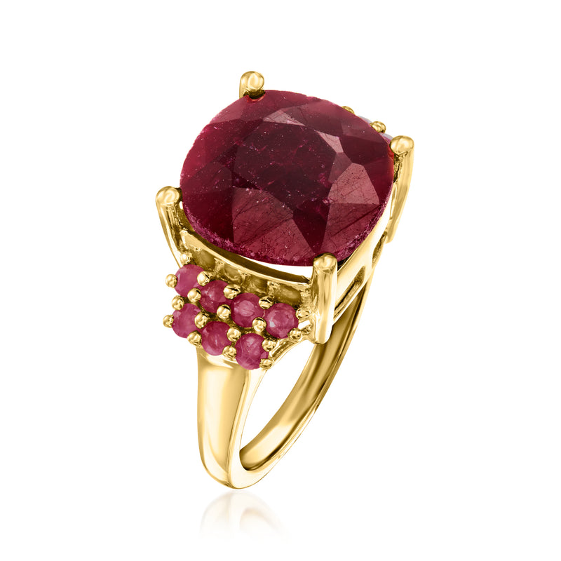 Ruby gemstone ring with faceted oval center and gold setting, pink accent stones
