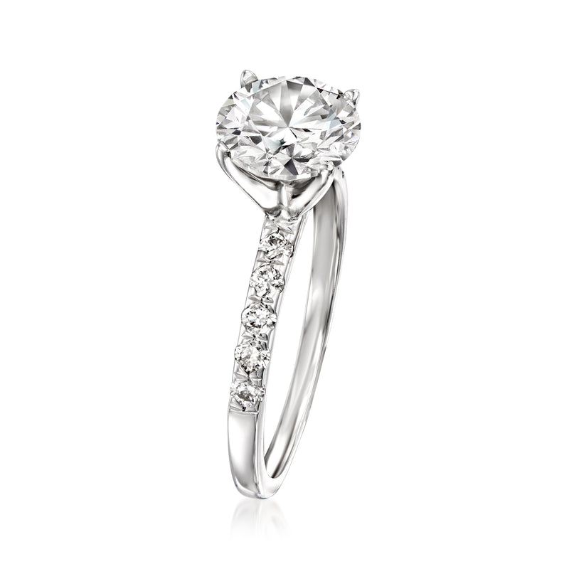 White gold lab-grown diamond ring with round center and baguette-cut stone accents