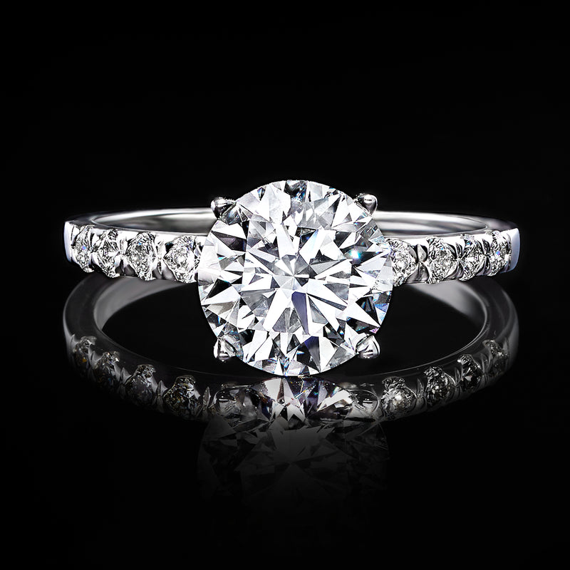 Lab-grown diamond engagement ring in white gold with round center stone and pavé side stones
