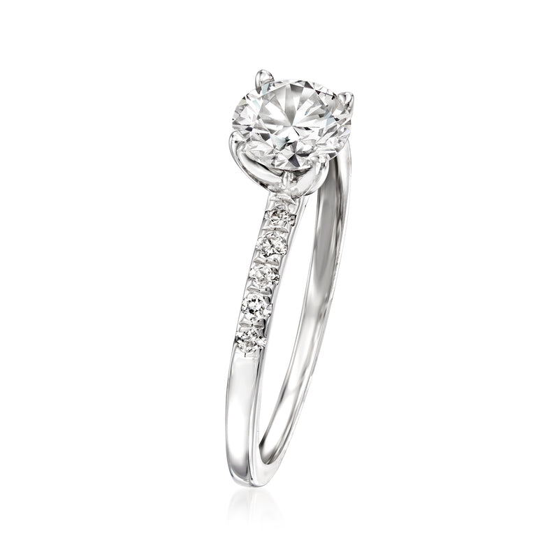 White gold lab-grown diamond engagement ring with round center stone and pavé band