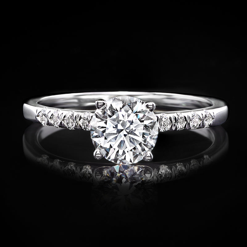 Lab-grown diamond engagement ring in white gold with round center stone and pavé band
