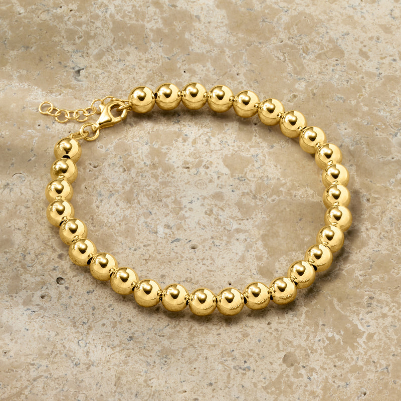 Yellow gold ball bead bracelet with round beads and chain extender