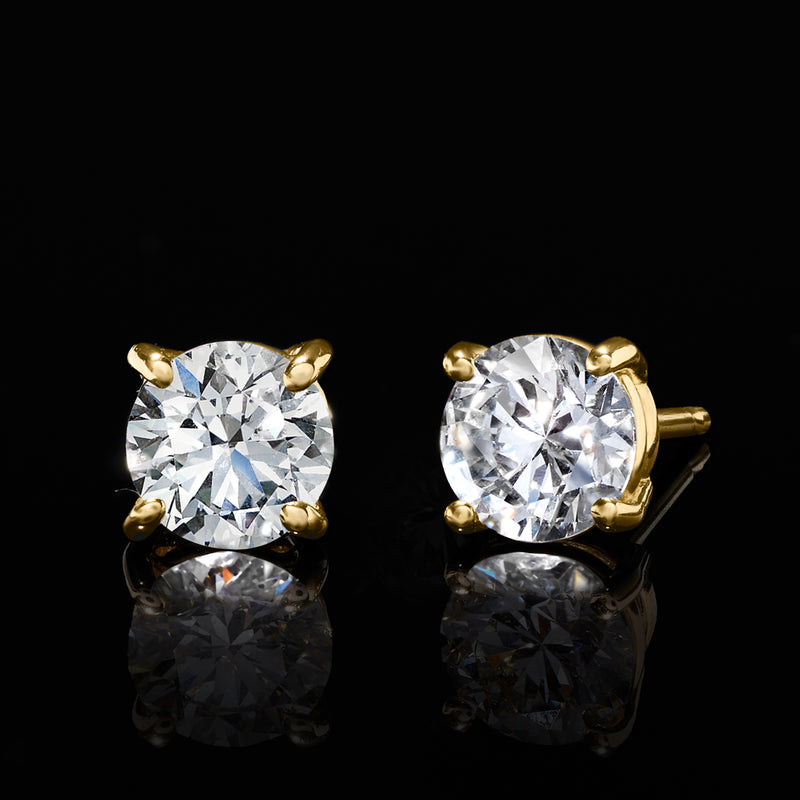 Round diamond stud earrings in 14kt yellow gold with butterfly posts