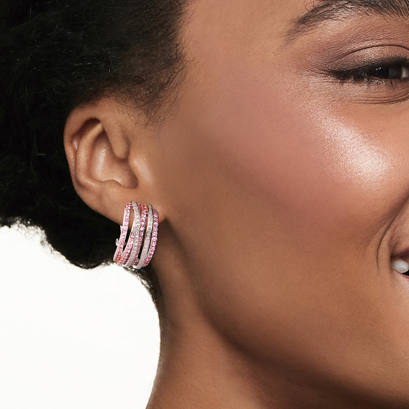 Pink sapphire and diamond hoop earrings on model, two-tone sterling silver