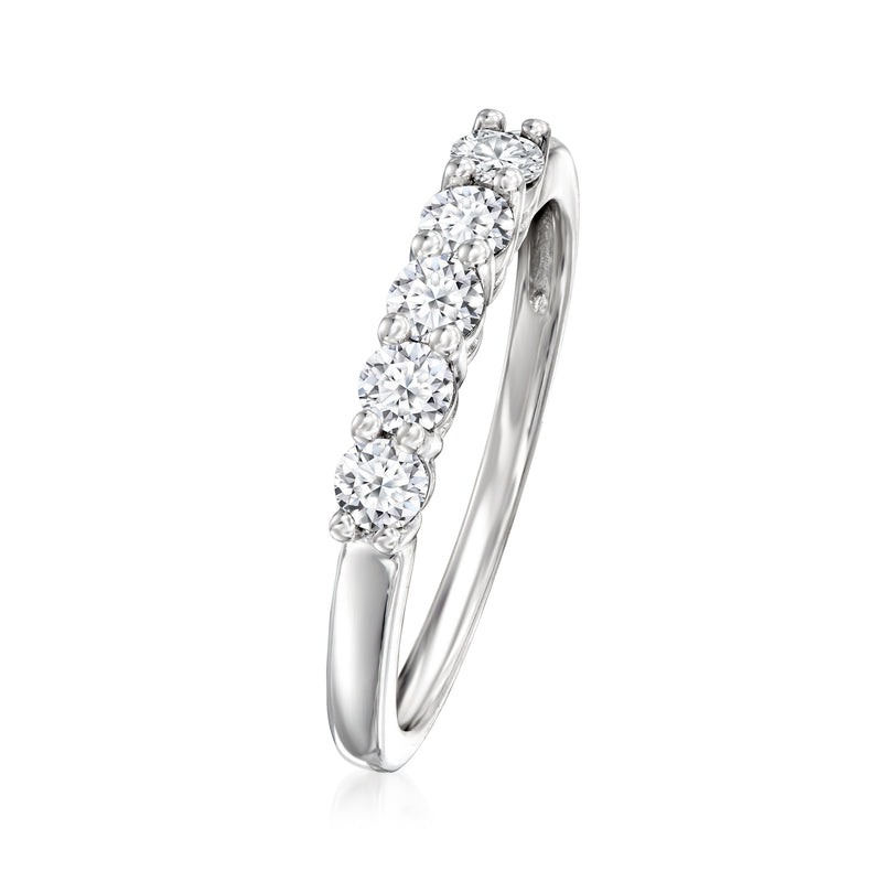 Sterling silver ring, side view, five round diamond stones on a slim band