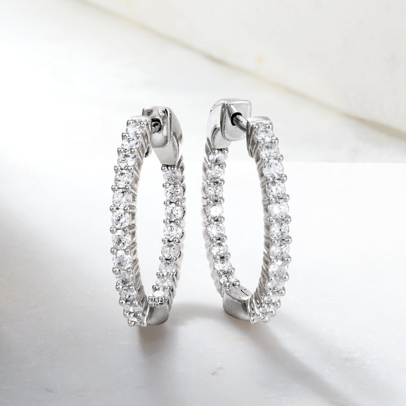 Sterling silver inside-outside hoop earrings with round diamond accents