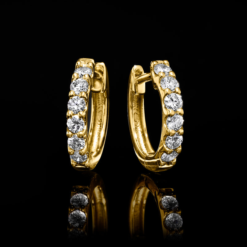 Gold hoop earrings with vertical row of round diamond accents, side view