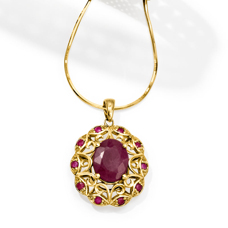 14kt yellow gold ruby openwork pendant, oval purple center with round halo stones