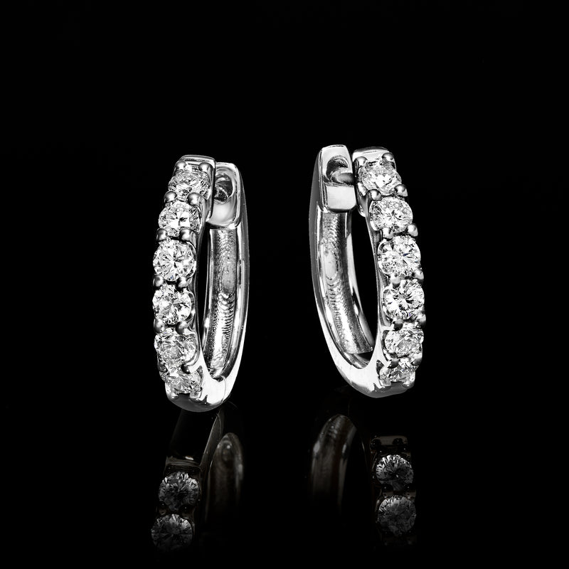 Sterling silver diamond hoop earrings, hinged clasp backs shown from the side