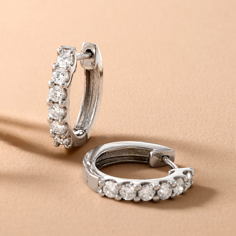 Sterling silver huggie hoop earrings with lab-grown diamonds in a half-hoop setting
