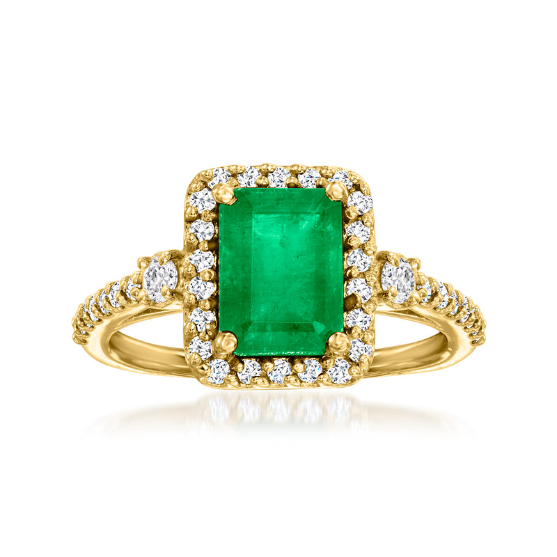 Emerald-cut green gemstone ring in 18kt yellow gold with diamond halo