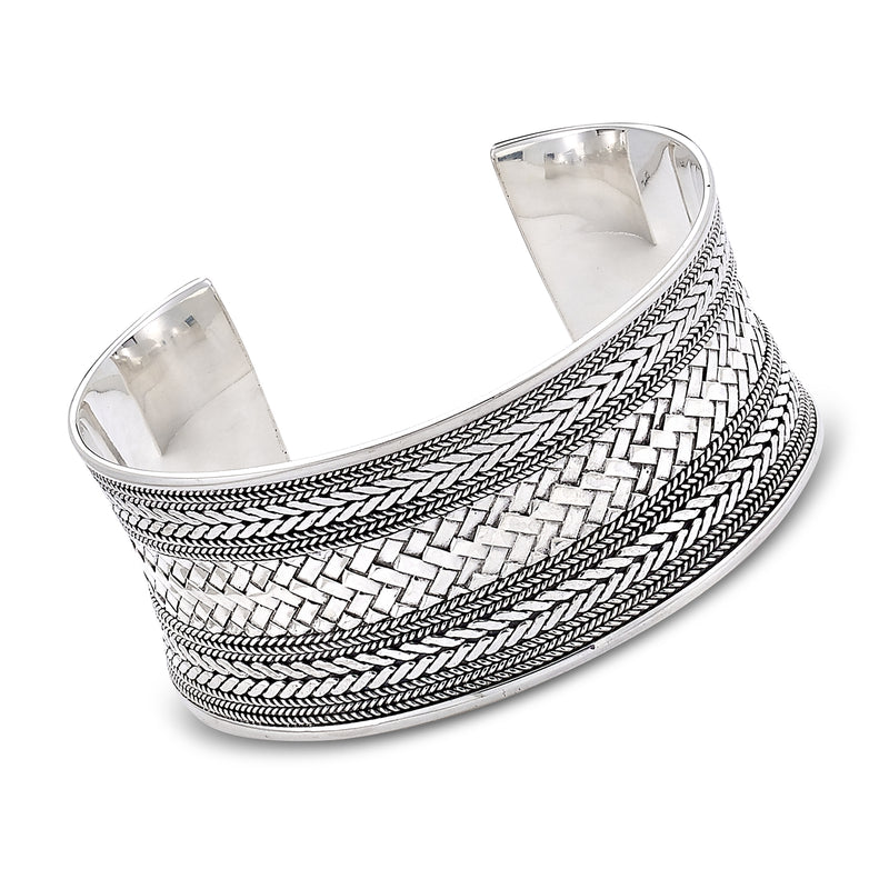 Sterling silver cuff bracelet with woven Bali-style braid pattern, wide hinged design