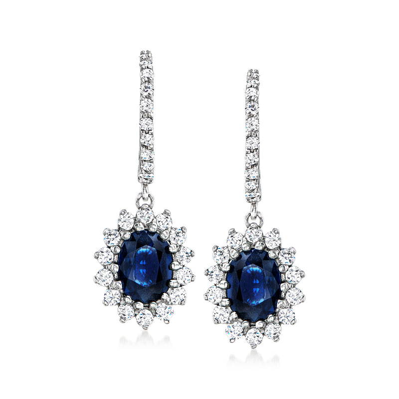 14kt white gold sapphire and diamond flower drop earrings with blue oval centers