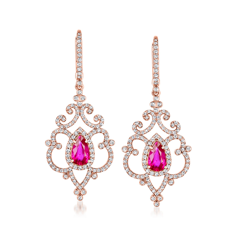 14kt rose gold ruby and diamond drop earrings with pink center stone and halo detail