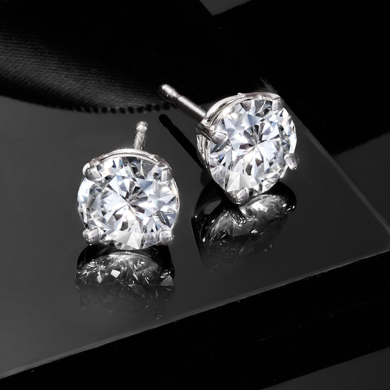 Sterling silver round lab-grown diamond stud earrings with visible prongs, close-up