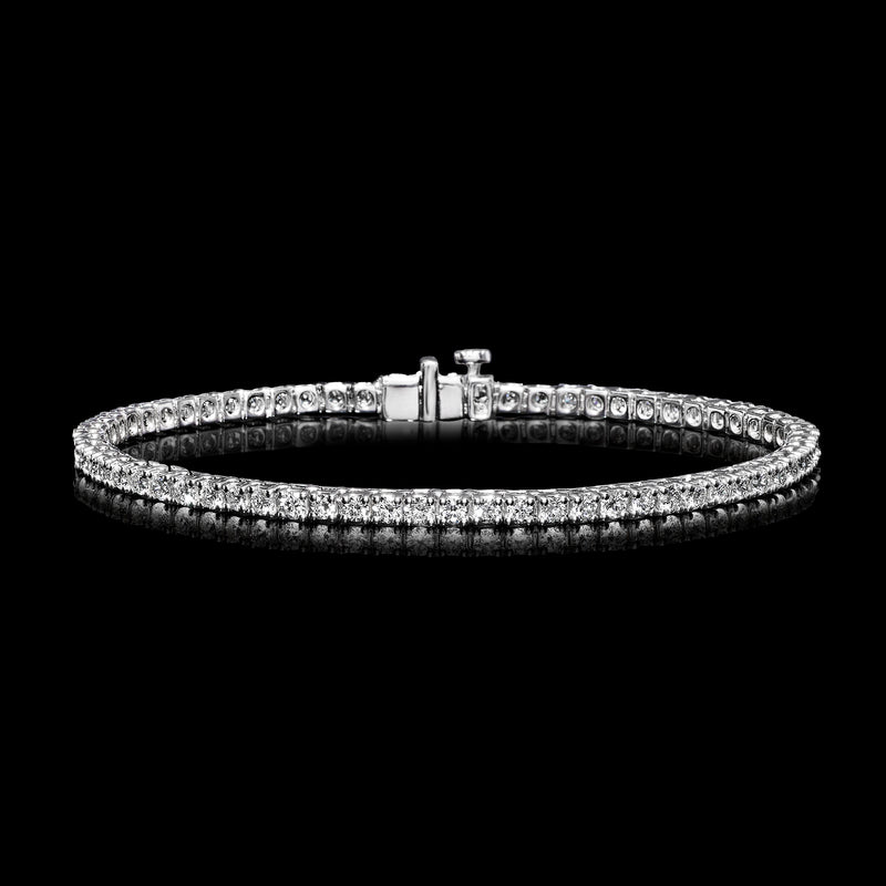 Sterling silver tennis bracelet with diamond line and clasp at center