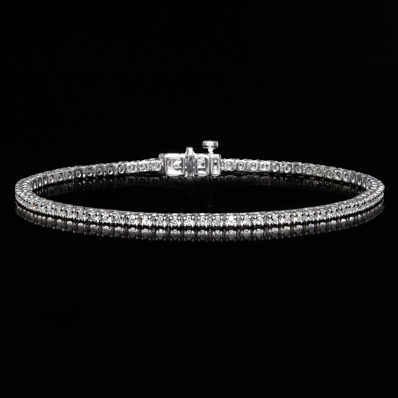 Sterling silver tennis bracelet with continuous row of round diamonds and box clasp