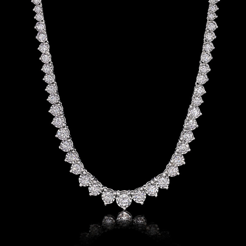 Sterling silver graduated diamond tennis necklace with small round stones and center accent