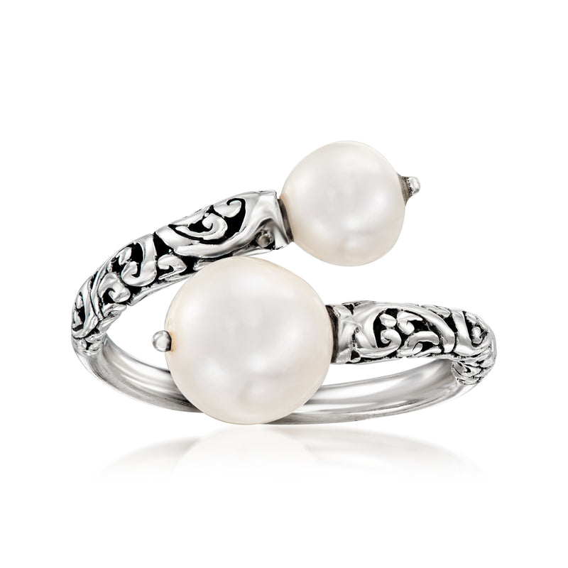 Sterling silver bypass ring with two round cultured pearls and ornate metal scrollwork