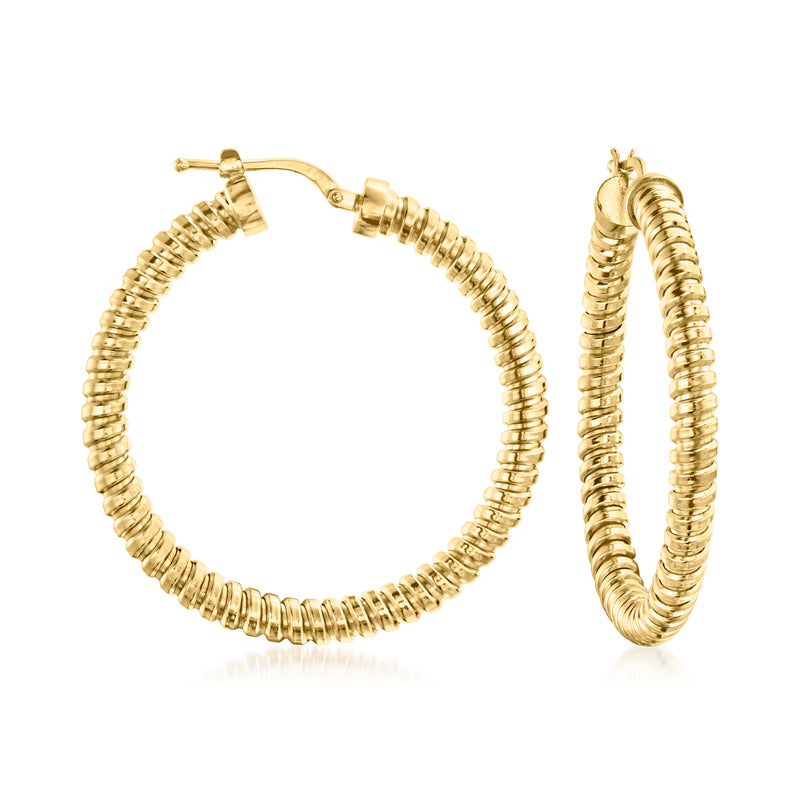 Gold-tone tubogas hoop earrings with ridged spiral texture and hinged clasp