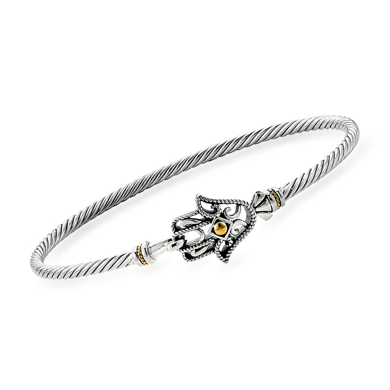 Sterling silver bangle bracelet with hamsa charm, evil eye motif, and small yellow enamel accents