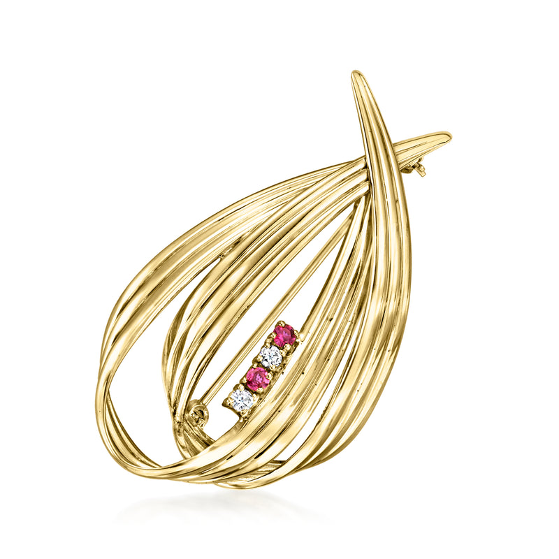 Vintage yellow gold ribbon pin with diamond accents and ruby-colored stones in center