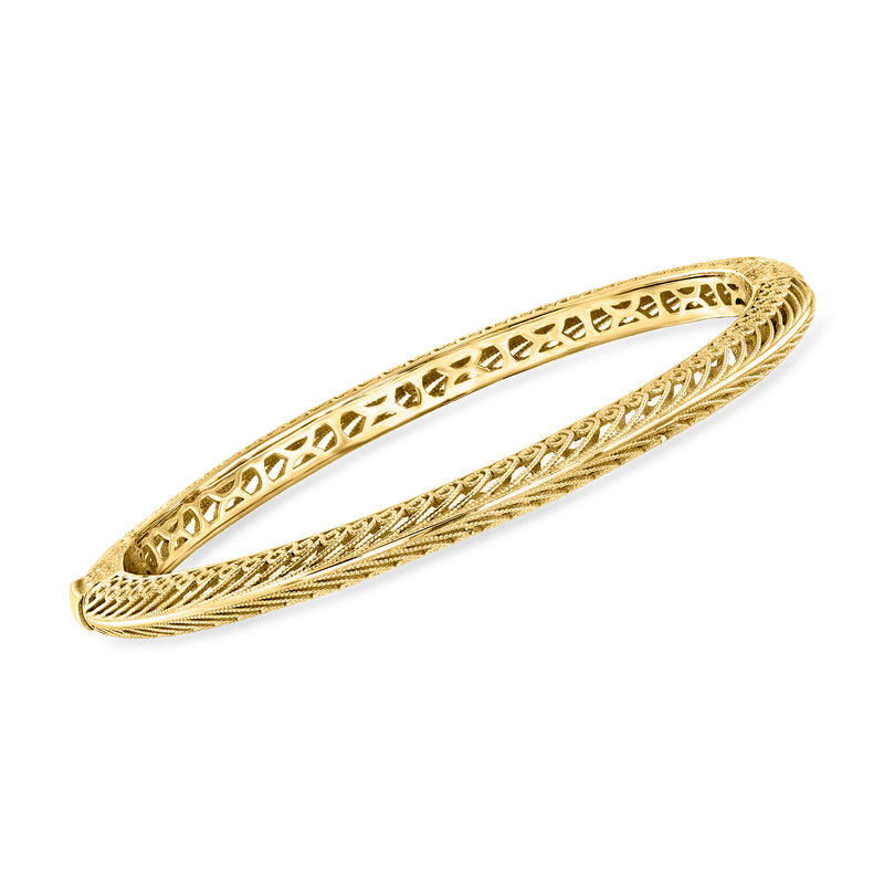 Gold over sterling filigree bangle bracelet with oval openwork and braided border