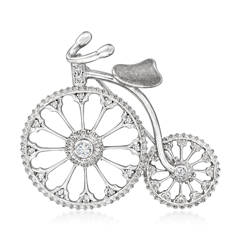 Diamond bicycle pin with openwork wheels and round stones, white gold.