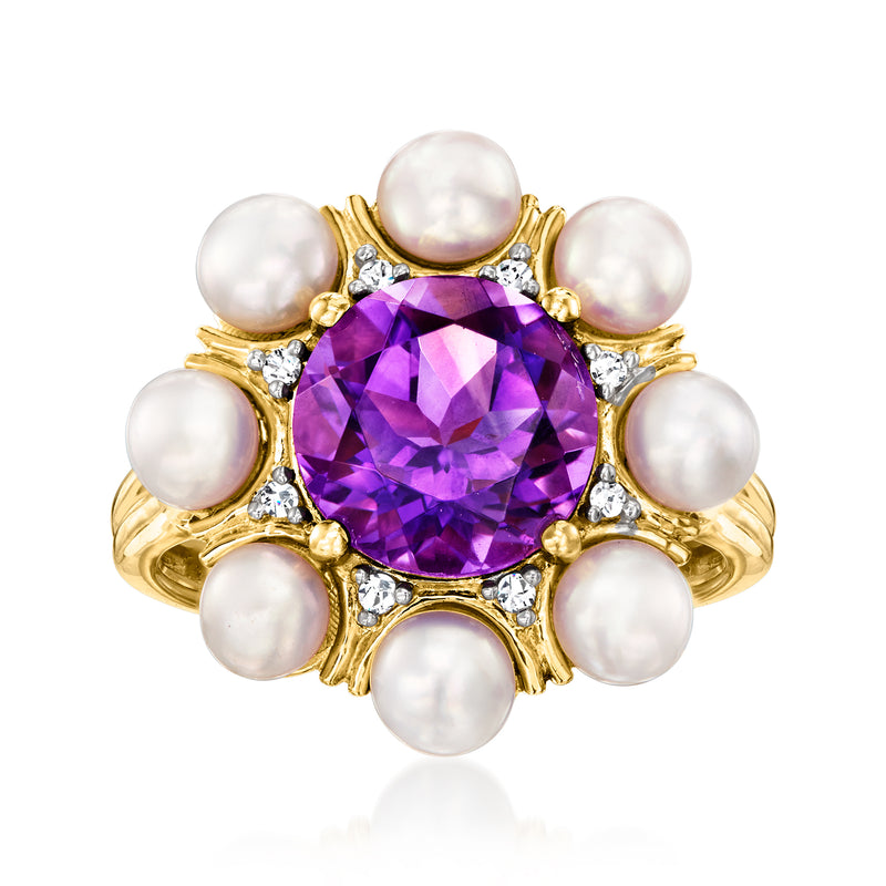 Gold ring with large purple amethyst center, diamond accents, and surrounding white pearls