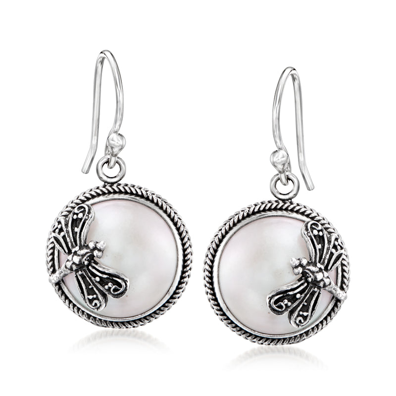 Sterling silver Bali-style drop earrings with round mother-of-pearl discs and dragonfly charm