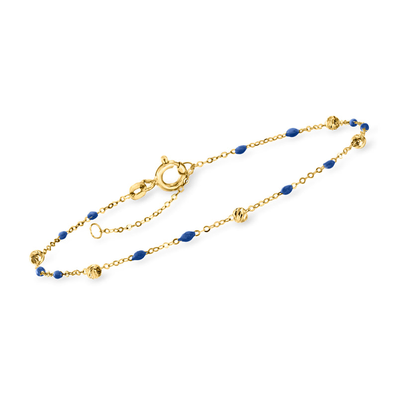 Yellow gold station bracelet with navy enamel bead accents and lobster clasp