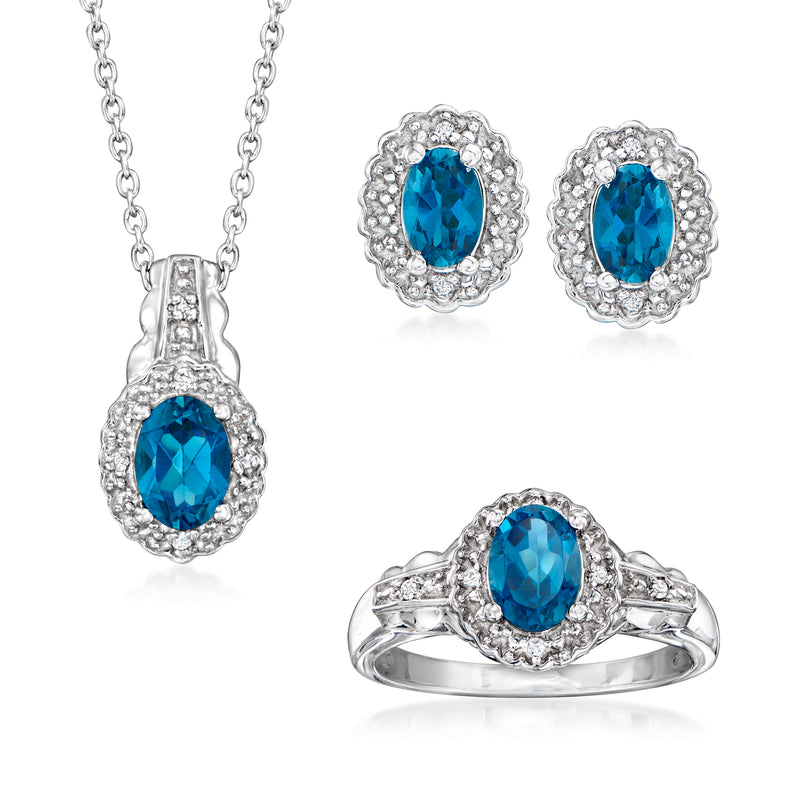 Sterling silver jewelry set with blue topaz pendant, oval earrings, and ring with white accents