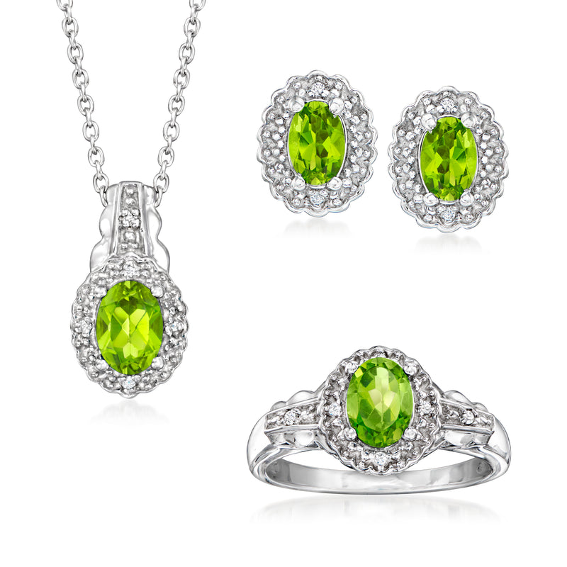 Sterling silver jewelry set with green peridot pendant, matching earrings, and ring