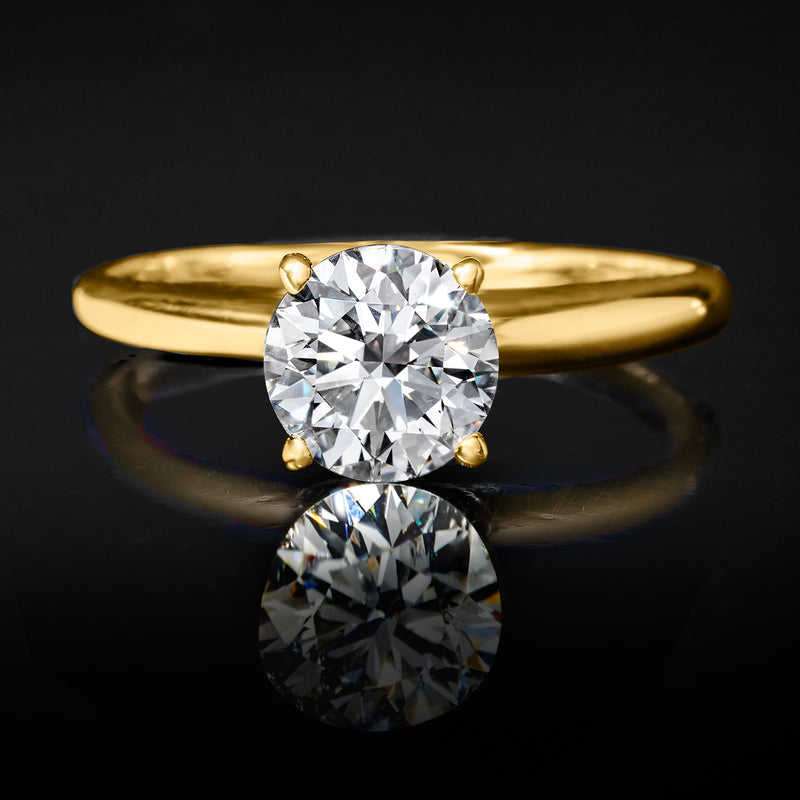 14kt yellow gold solitaire ring with round diamond centerpiece and smooth band