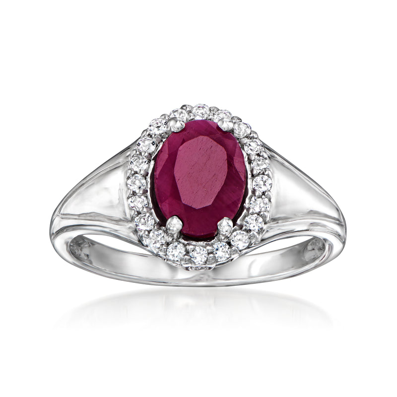 Sterling silver ring with oval ruby center and white topaz halo stones