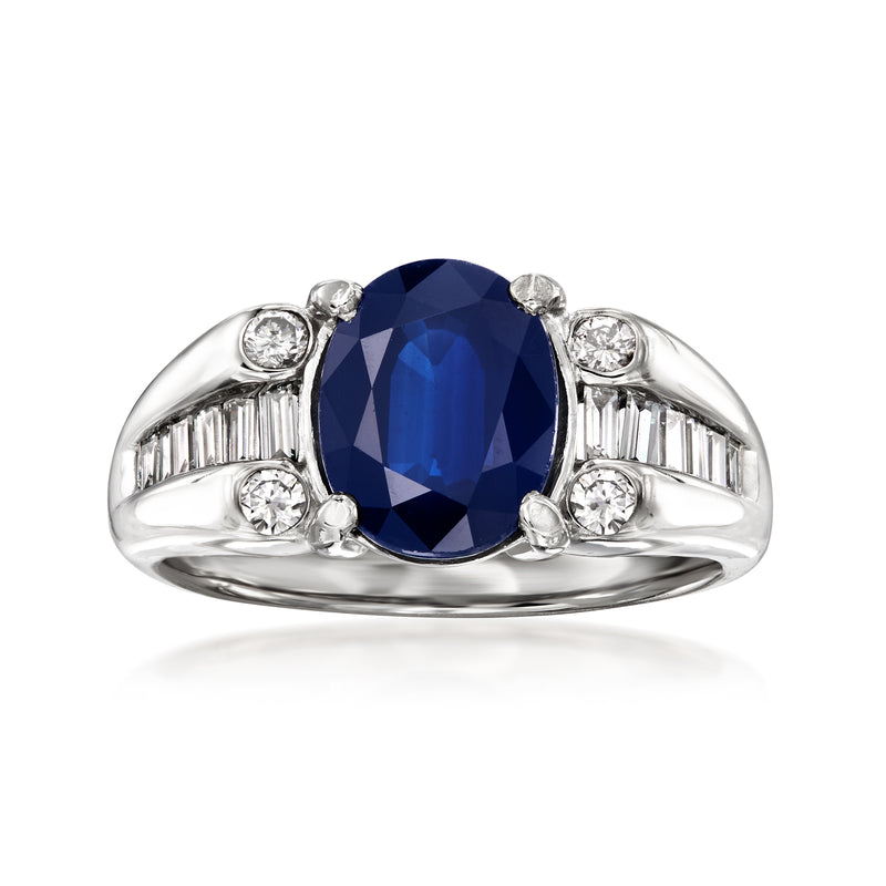 Platinum ring with oval blue sapphire center and diamond side stones