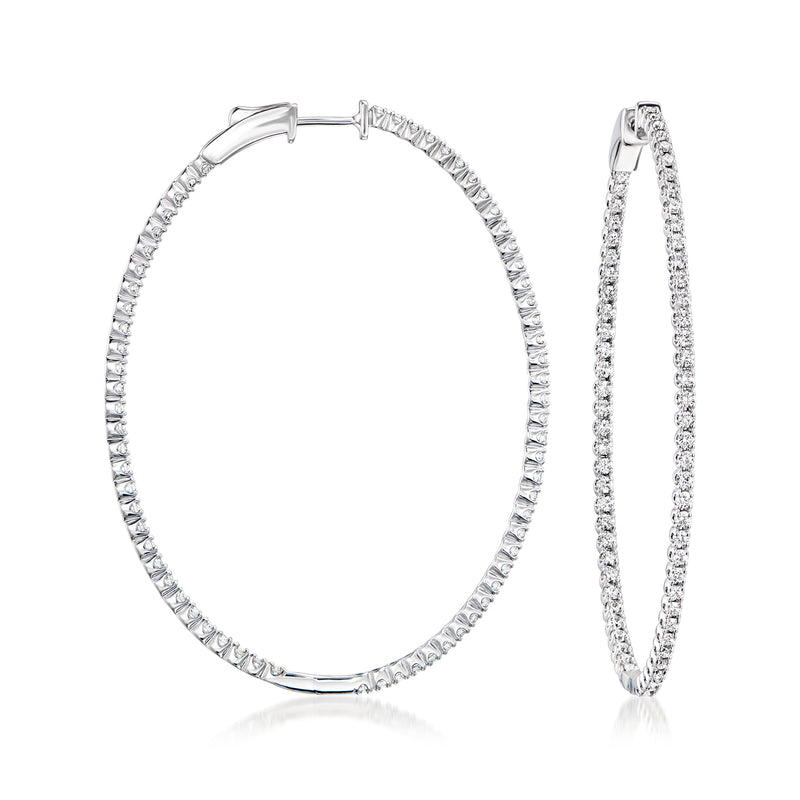 Oval inside-out hoop earrings in 14kt white gold with diamond pave detailing