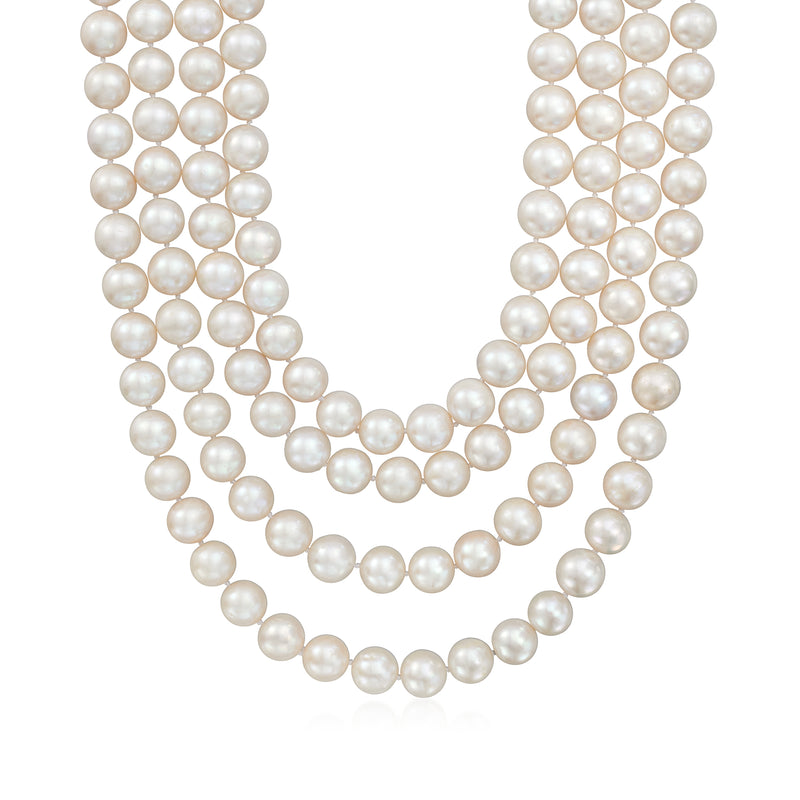 Multi-strand white cultured pearl necklace with gold clasp