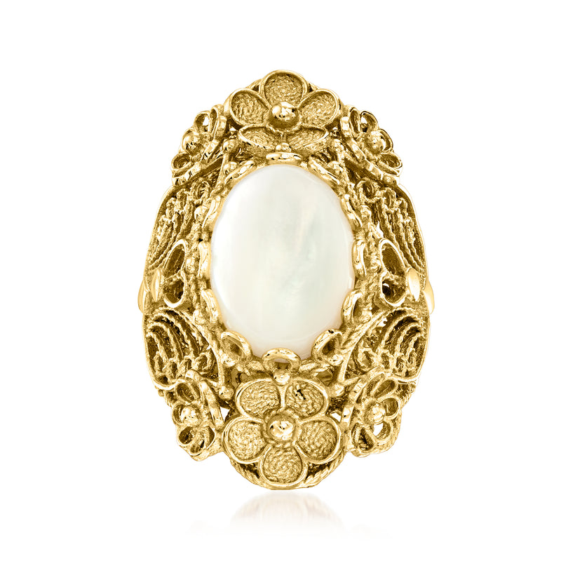 Gold over sterling ring with oval mother-of-pearl center and floral filigree frame