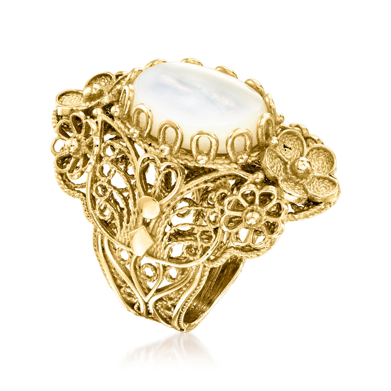 Gold over sterling mother-of-pearl oval ring shown from side with ornate floral filigree