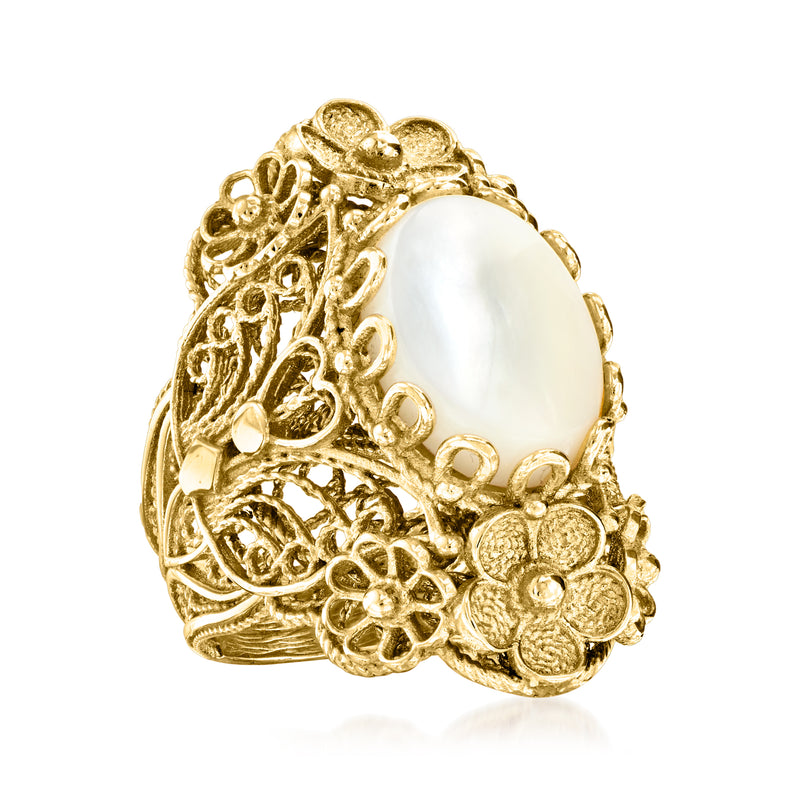 Gold-tone oval mother-of-pearl ring with detailed floral filigree and scalloped edges