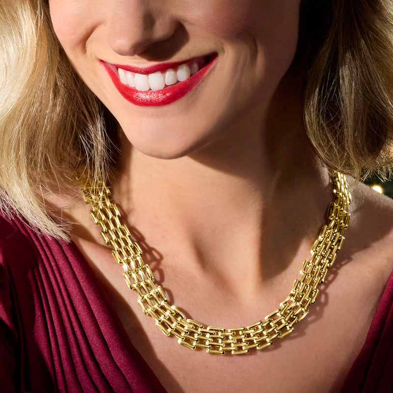 14kt yellow gold chain-link necklace worn close-up, repeating interlocked links