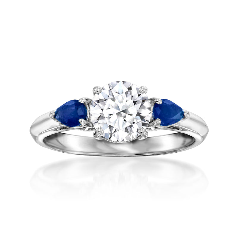 14kt white gold ring with round diamond center and blue sapphire side stones