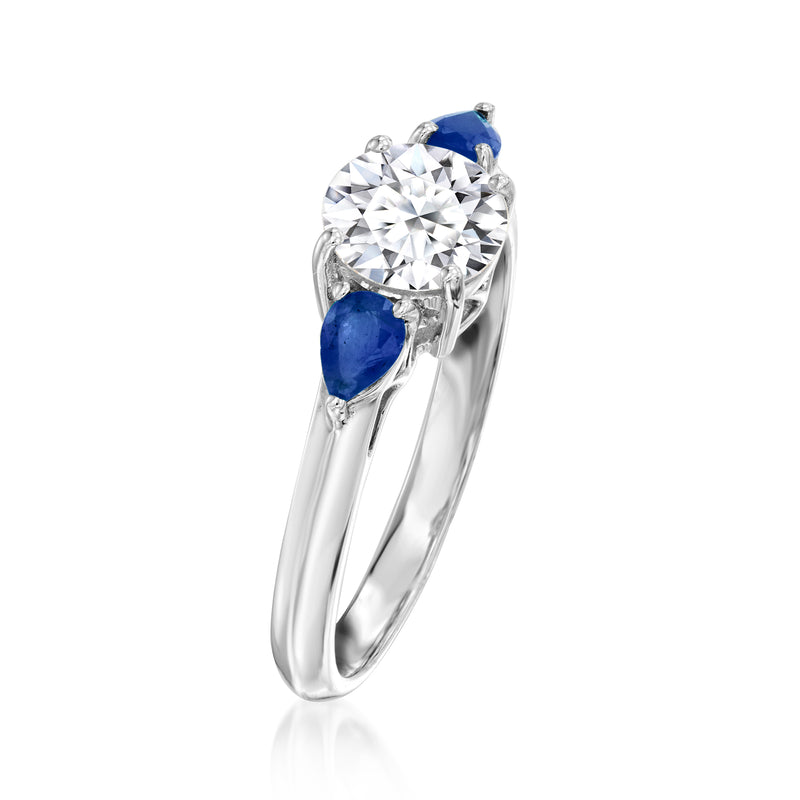 14kt white gold diamond ring with round center stone and pear blue sapphire accents