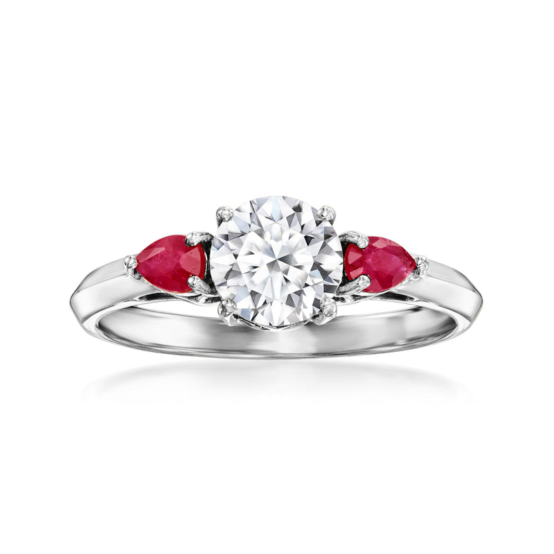 14kt white gold ring with round diamond center and two red ruby side stones
