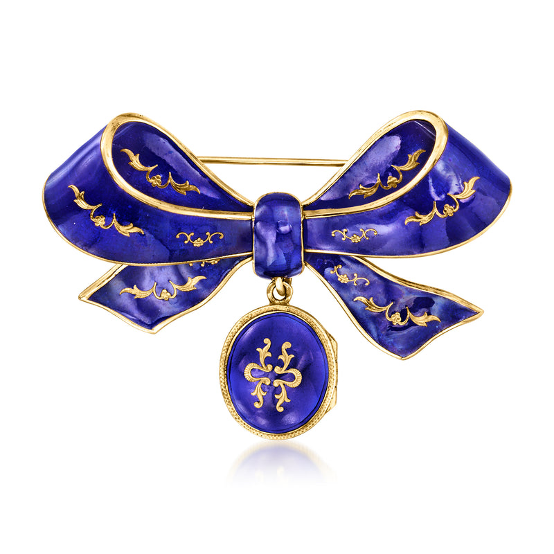 Blue enamel bow pin with gold scrollwork and round locket pendant in yellow gold