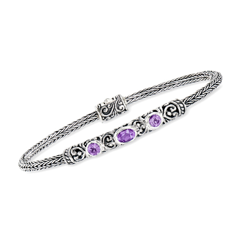 Sterling silver Bali-style bracelet with braided links and round amethyst purple stones