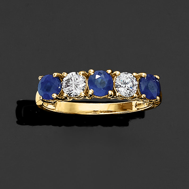 Yellow gold five-stone ring with blue sapphires and round diamonds on slim band